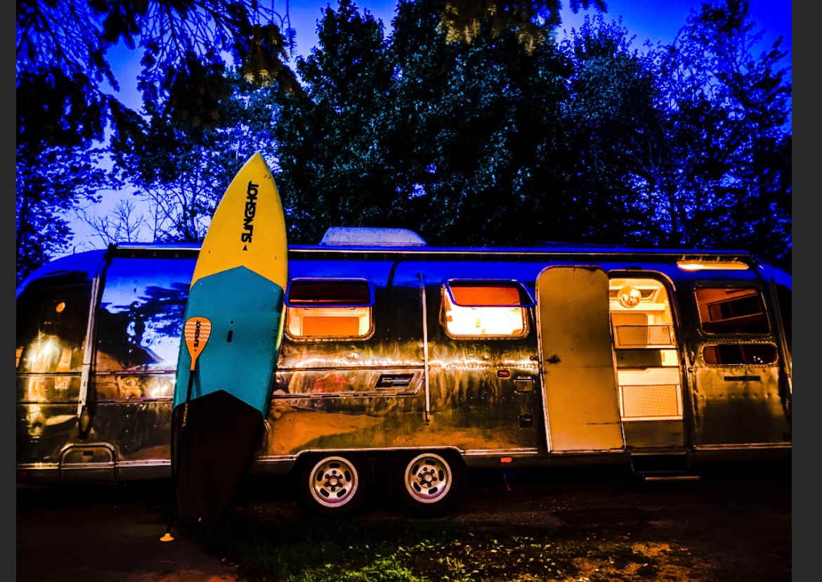 The airstream was parked up in front of the chalet in this picture so I will have it pulled down underneath the back of the house in the backyard this summer and then you can go right in and use the garage and the bathroom in the garage