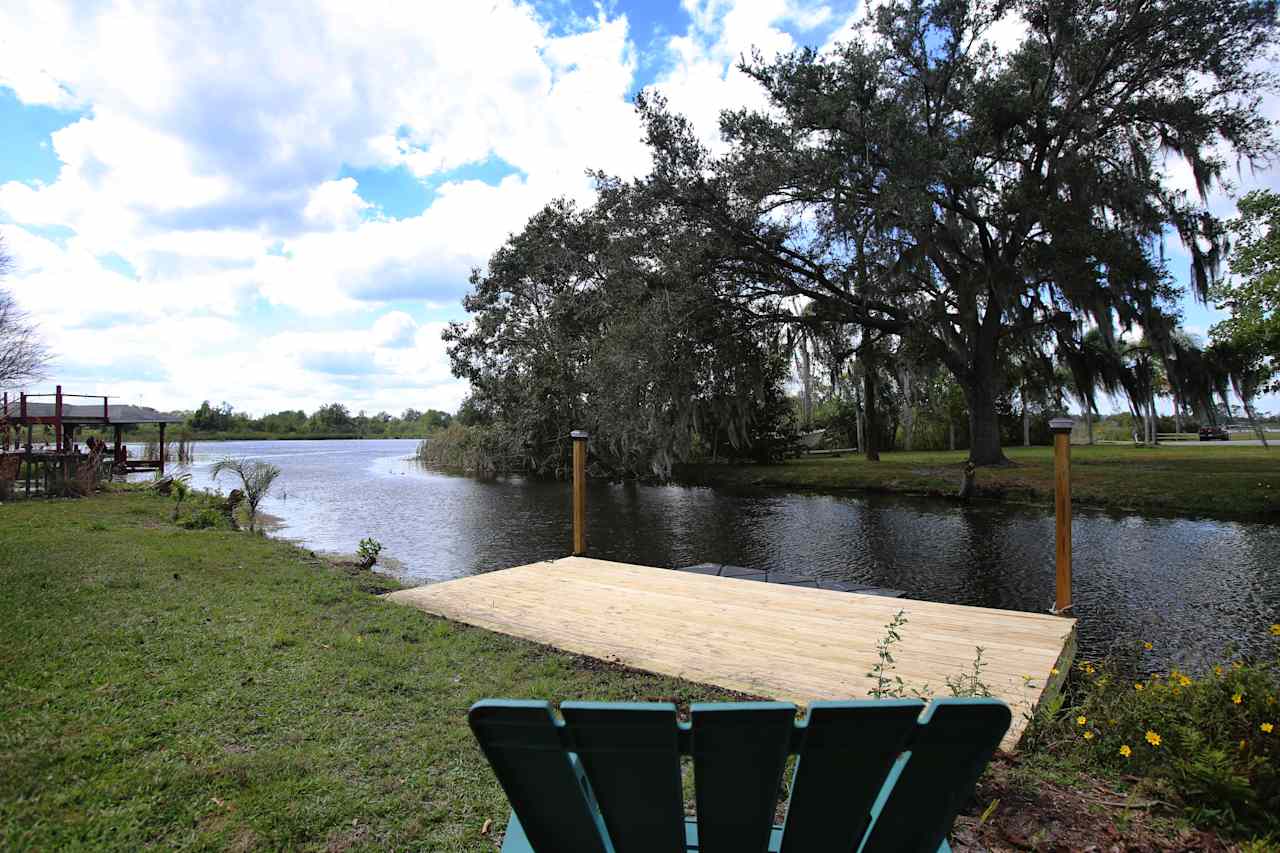 Private dock on a secluded canal is perfect for launching kayak or canoe (included with property), or motorized boat