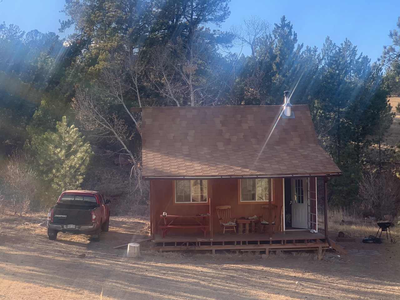 An 'artistic' shot of the cabin from the little mound in front, where we pulled up some camp chairs and sat in the sun one afternoon.