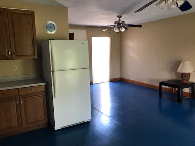 From the kitchen towards the back/main entrance and parking area.