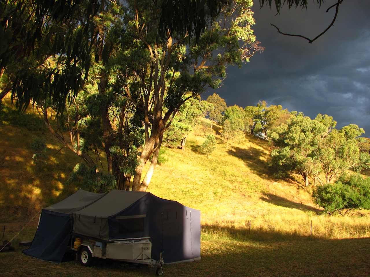 Afternoon sun catching the hills behind the creek campsite.