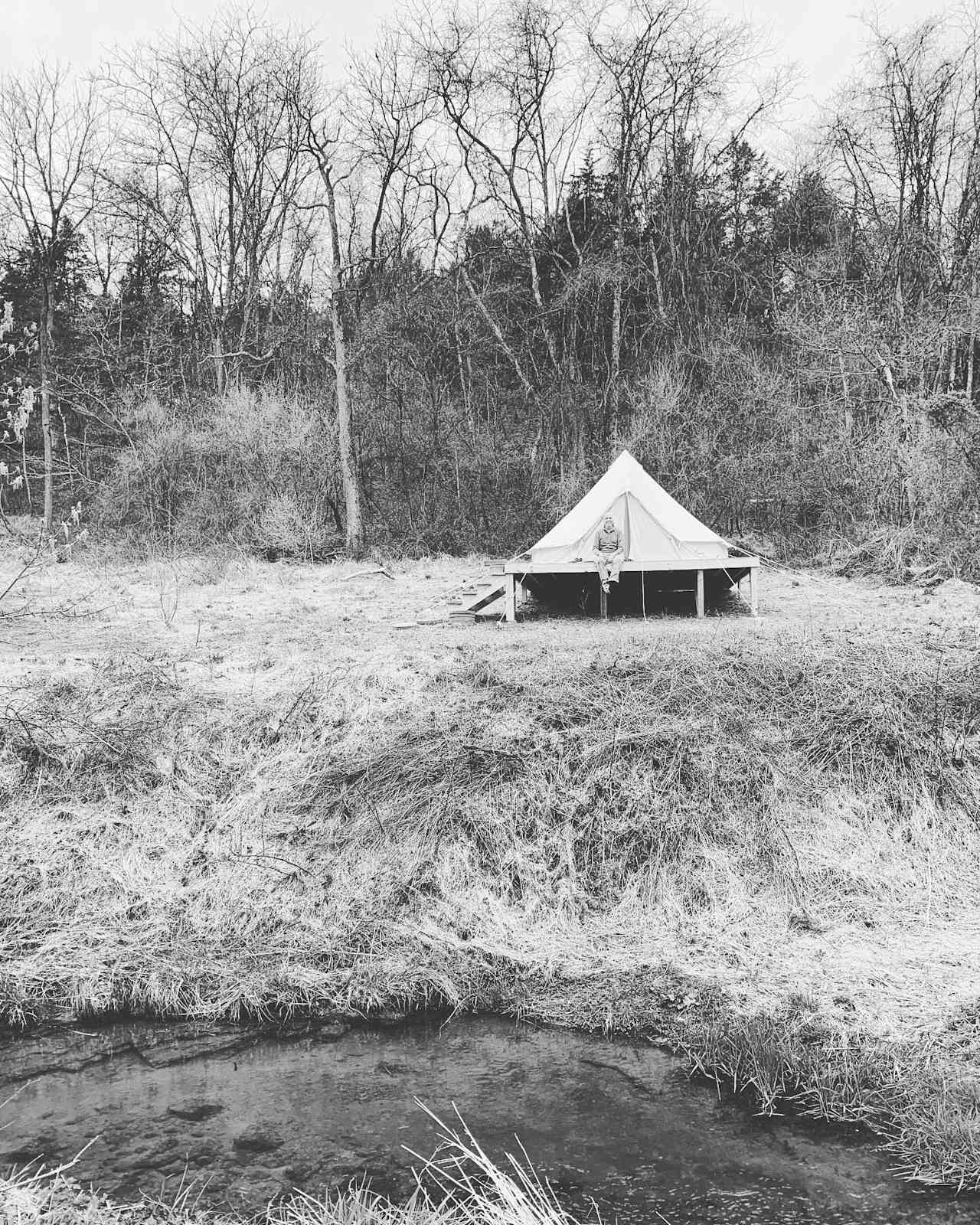 a happy camper at the bell tent