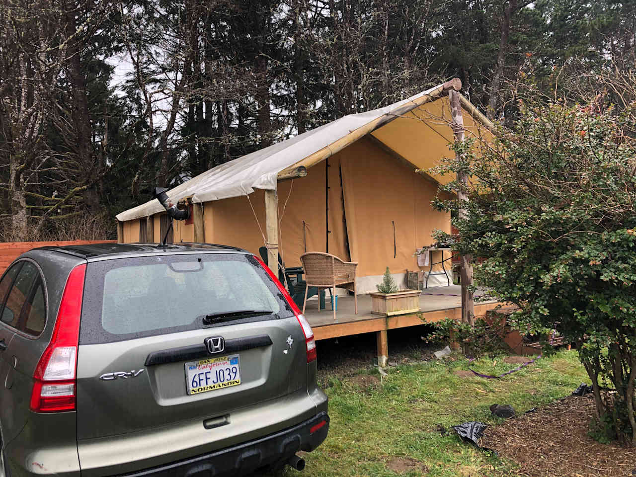 My car parked next to the tent