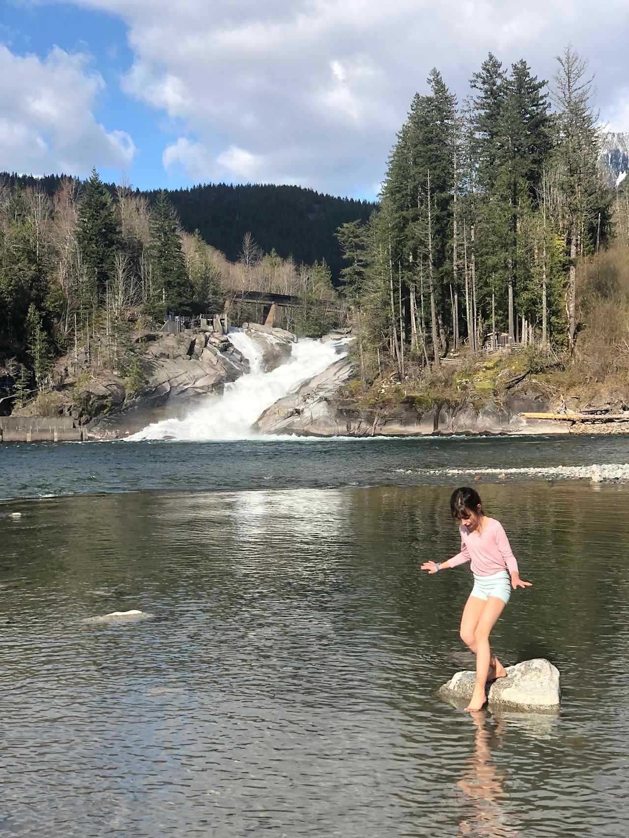 enjoy a refreshing fresh water bath in a warm summer afternoon. with a waterfall view 