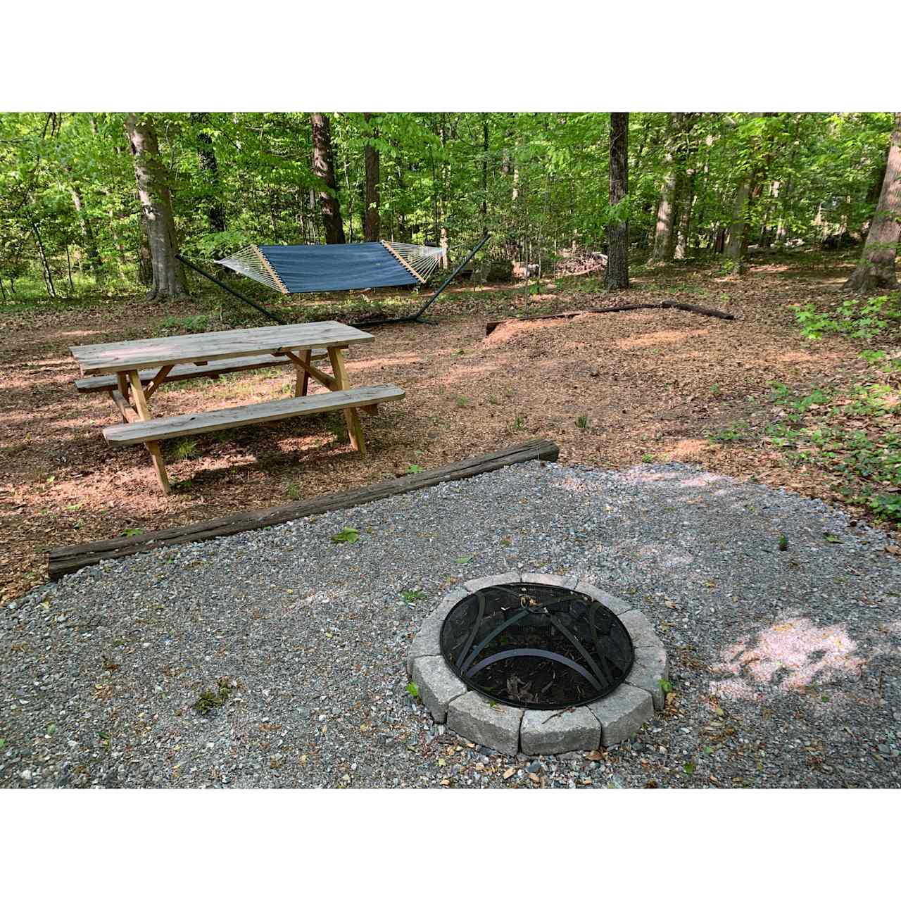 Site W includes 2 leveled tent spaces, a picnic table, an extra table and chairs, a fire pit, and a hammock!