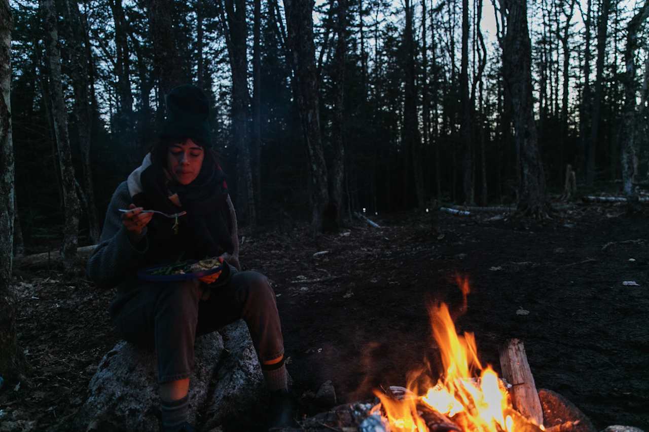 Eating dinner in the woods next to a cozy fire. It doesn't get much better than this!