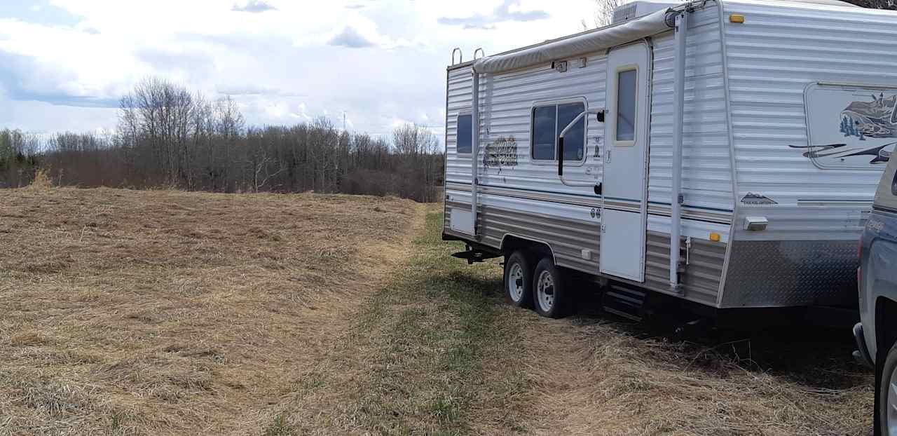 Trailer sites are on top of a hill at the edge of the pasture.