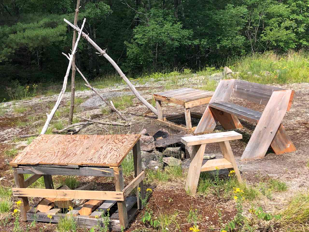 Bench, table, stool, firepit.  Thunderbox (not shown).