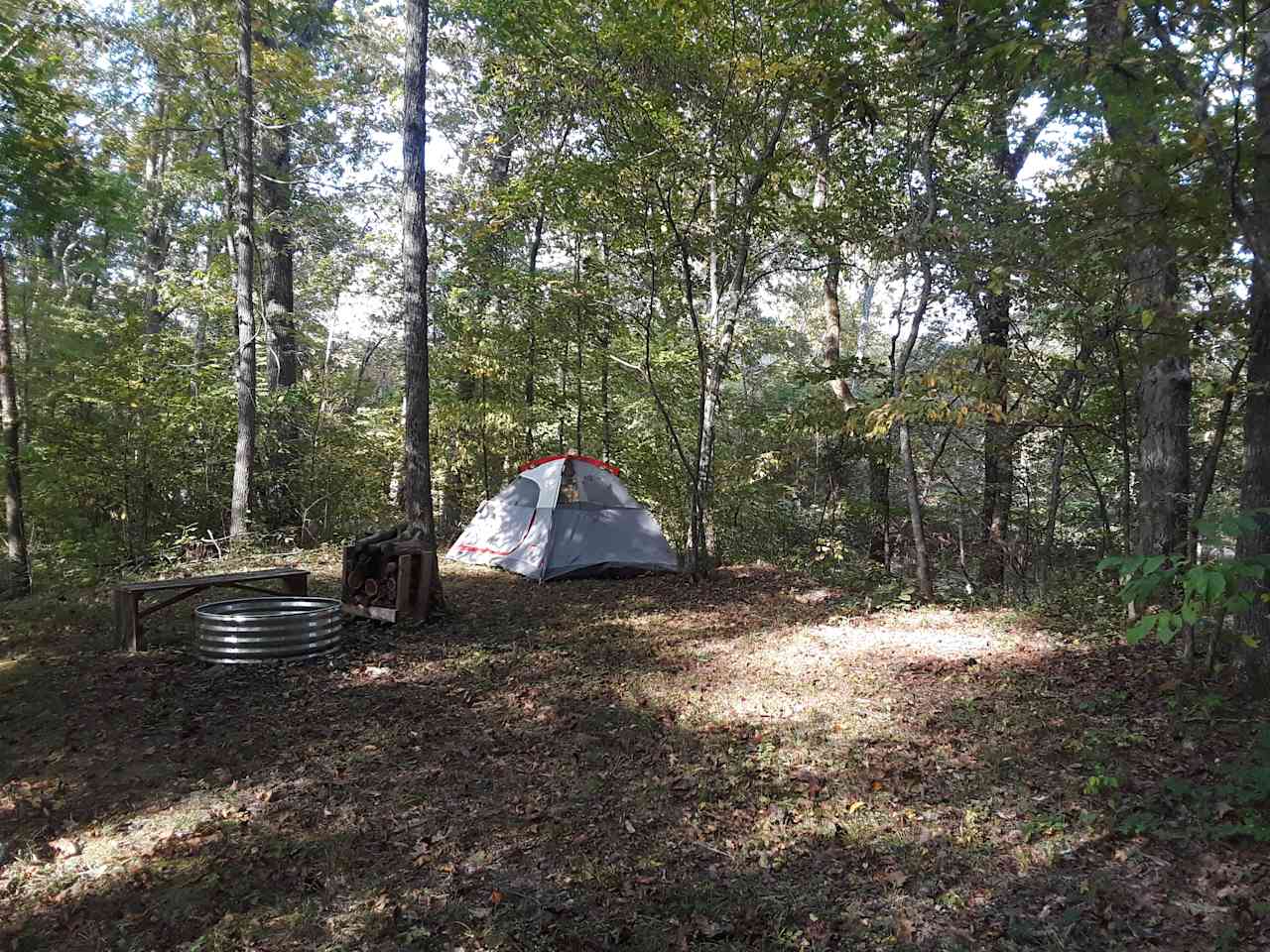 This is campsite 2 located near the creek not on it like 1 is. It’s the smallest of them all but surrounded by woods an closest  to the outhouse.  It can hold 2 maybe 3 small size tents.