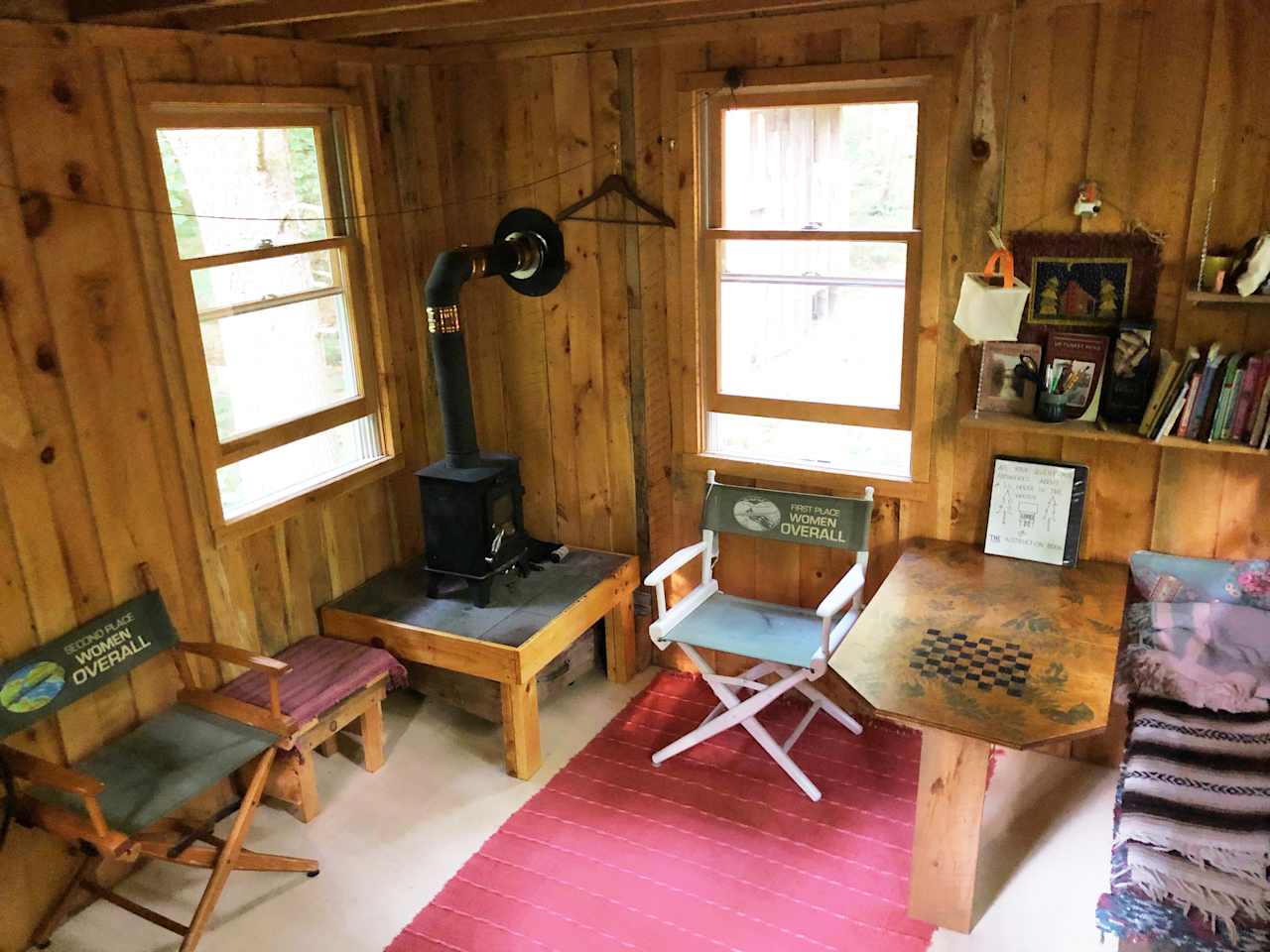 Tiny stove and seating, plus a selection of books and games.