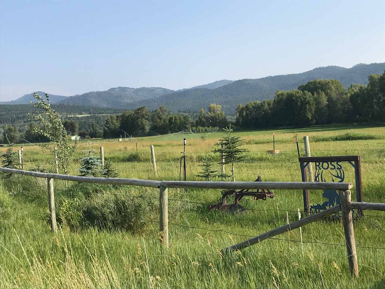 Here it is!  This is much more peaceful choice than a regular RV site!  Your site is directly behind the Ross Meadows sign and the old plow.  Notice the flagged metal stakes with white rope around your camping area! 
It's a drive through spot for RV's. 