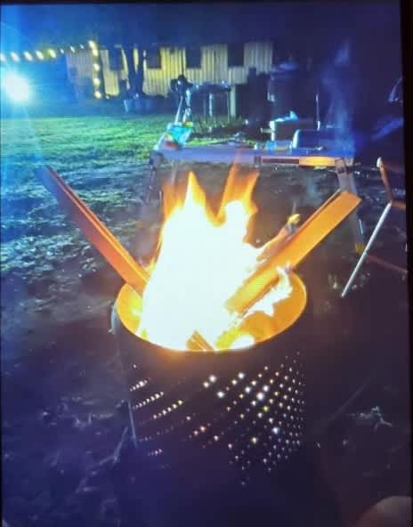 A small washtub fire pit