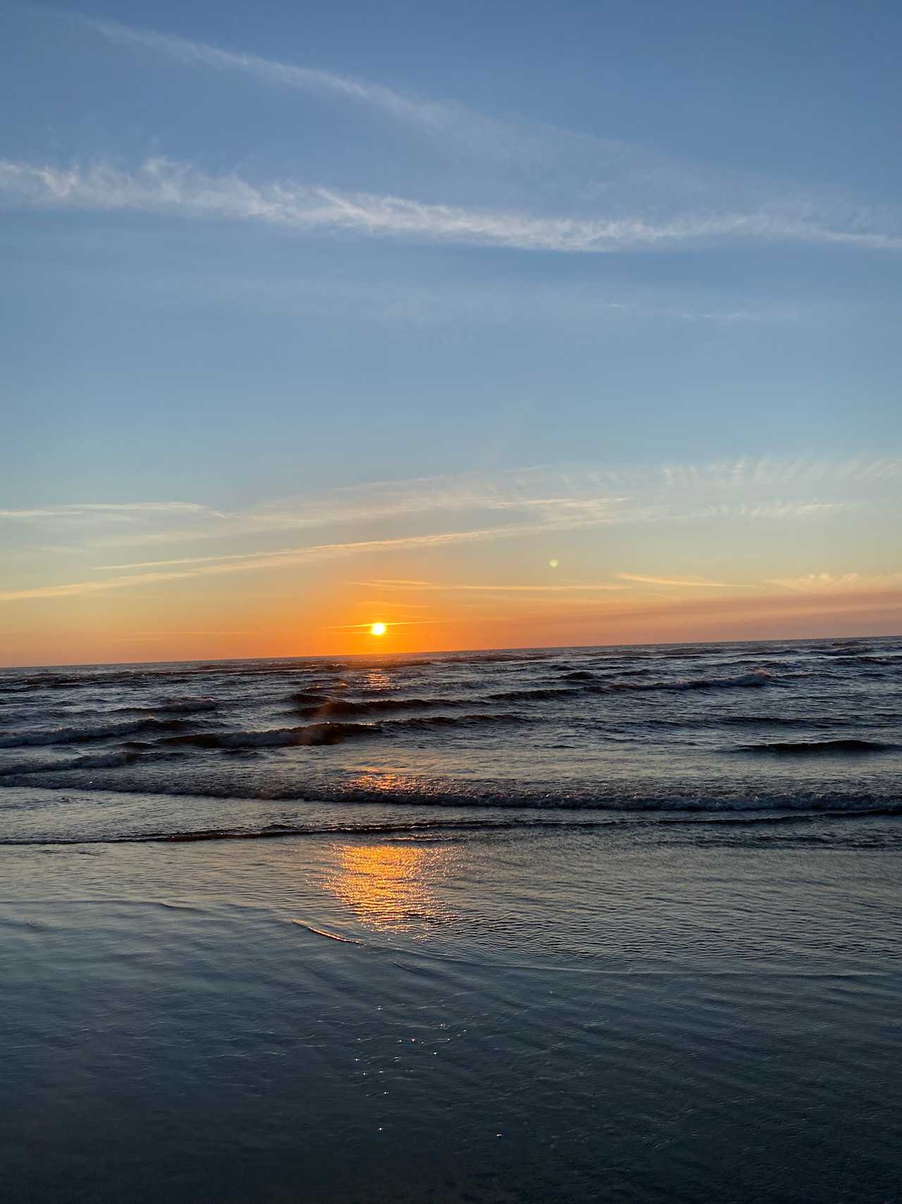 About a 5 minute car ride from this beautiful beach with incredible sunsets 