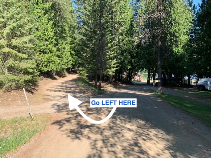 Just 250 feet from the boat ramp, you want to go LEFT up Mirror Lake Rd.  Disregard the "Private Property - No Trespassing" signs on the road.