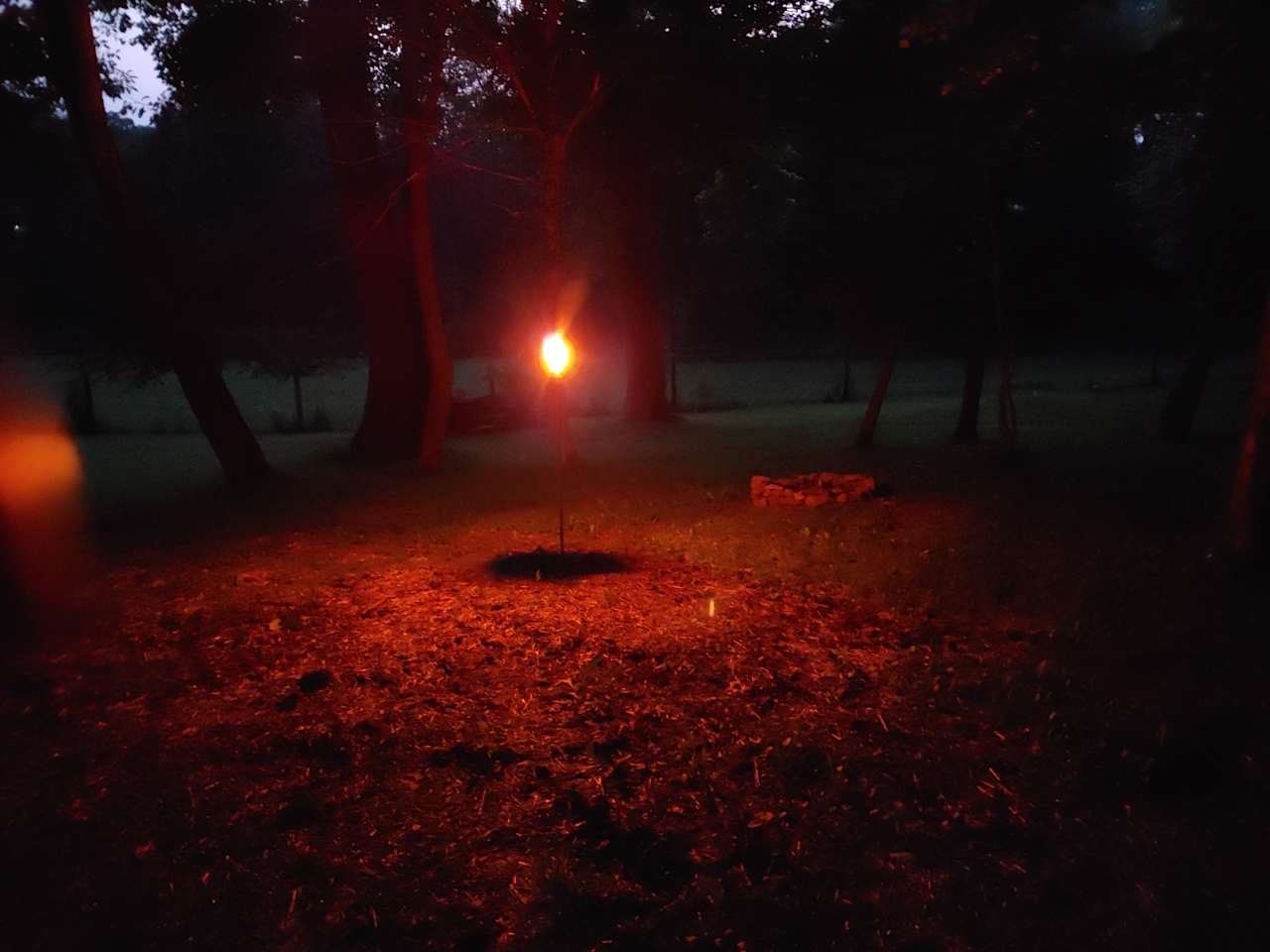 Nighttime glow of tiki torches. All sites have a tiki torch. 