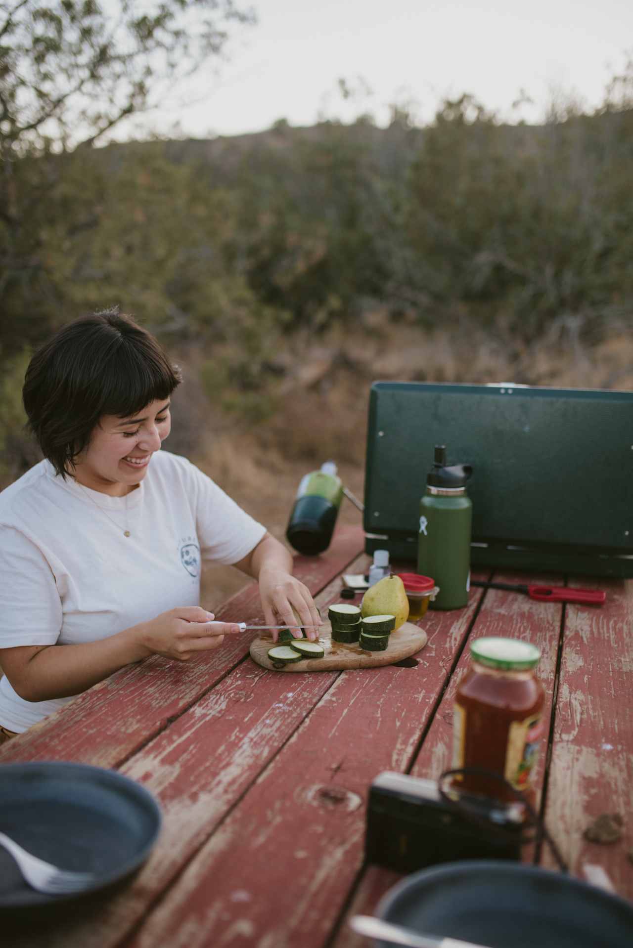 Prepping dinner at the picnic table. 