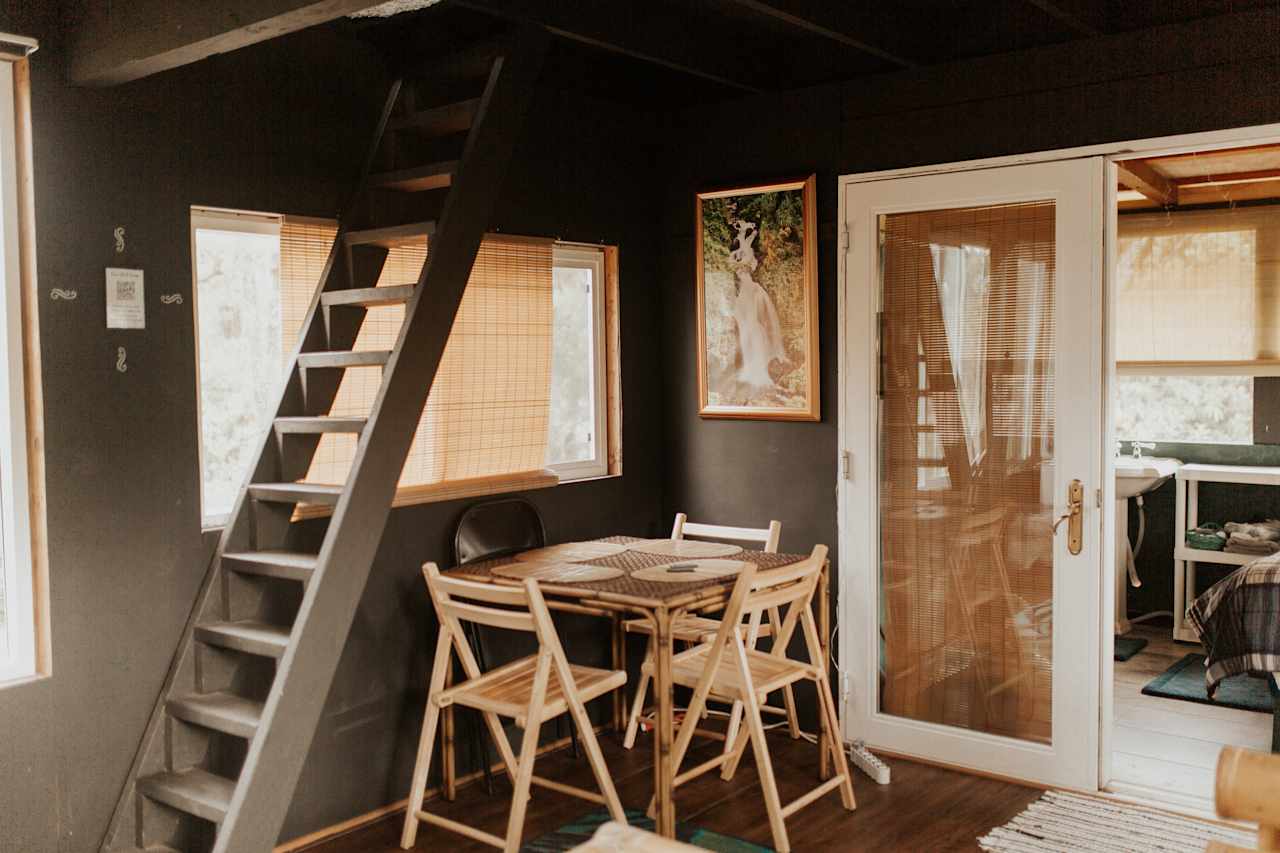 dining area and stairs to the loft