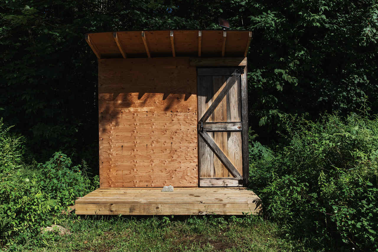 The upper field had several outhouses for campers to use. 