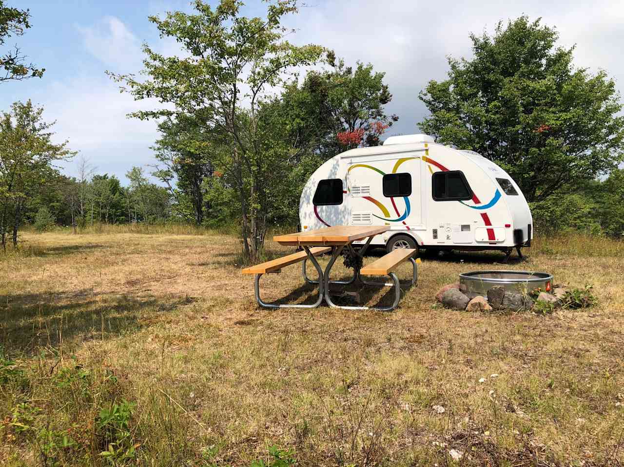 Site #4 (shown with a camper)