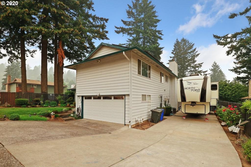 Full hookups on cement pad beside single family home- NOTE: driveway is steep to enter and requires skilled driver. 