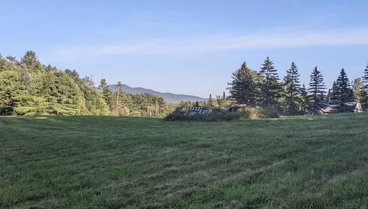 Open field with view of Cherry Mountain