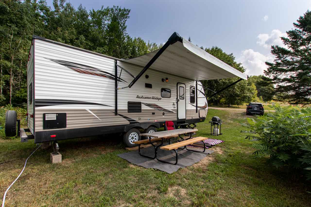 Welcome to Stone Oaks Farm. This travel trailer sits on 125 beautiful acres overlooking the farm.