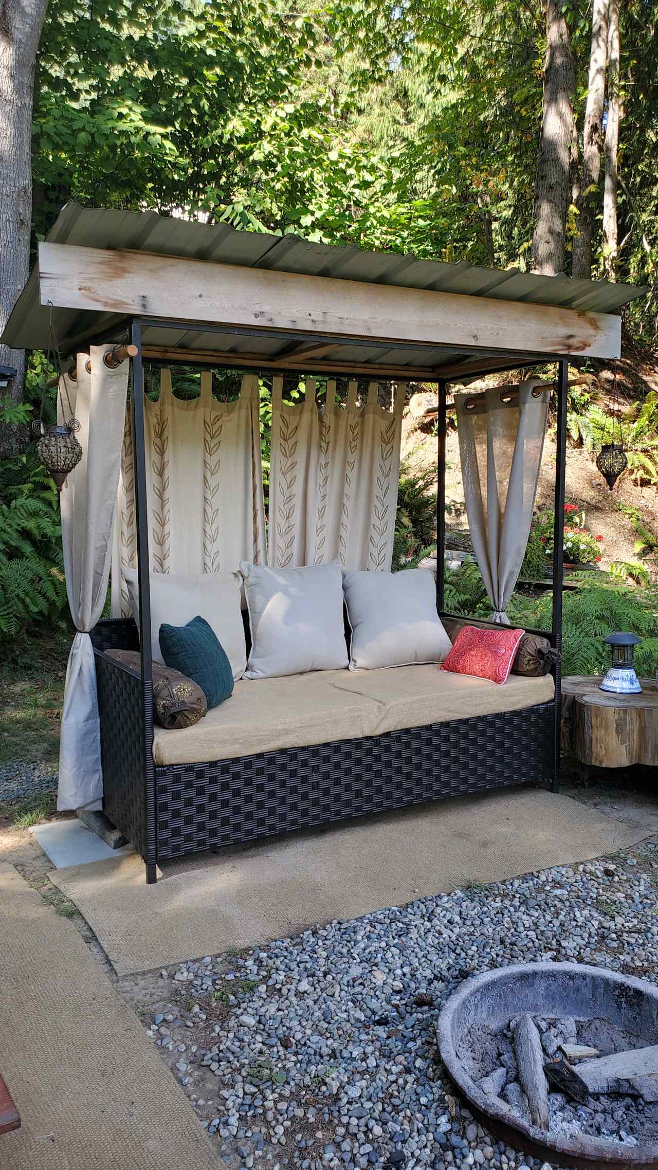 Seating area by the firepit over looking the Fraser River.