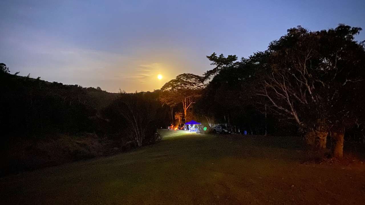 Full moon rising over the campsite and the river