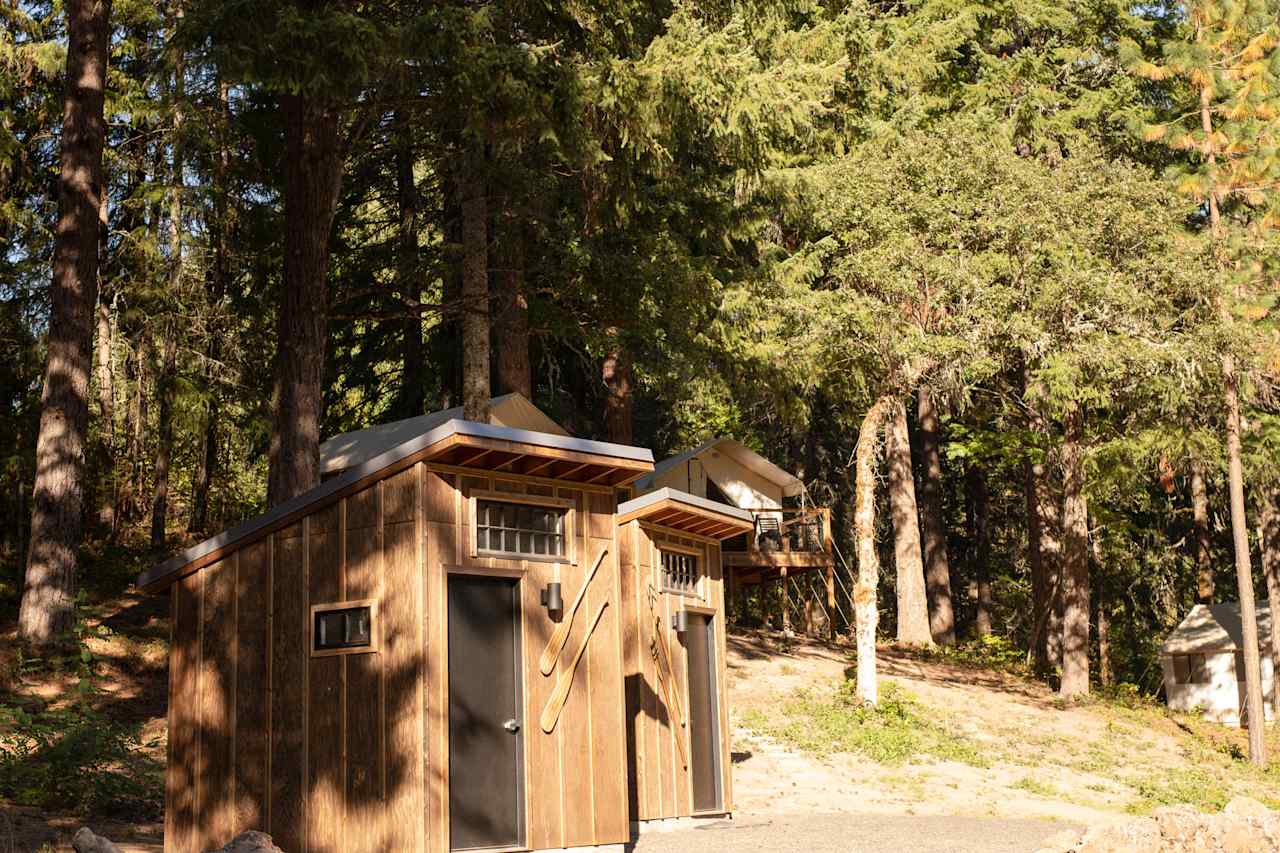 The two full bathrooms with the glamp sites in the back.