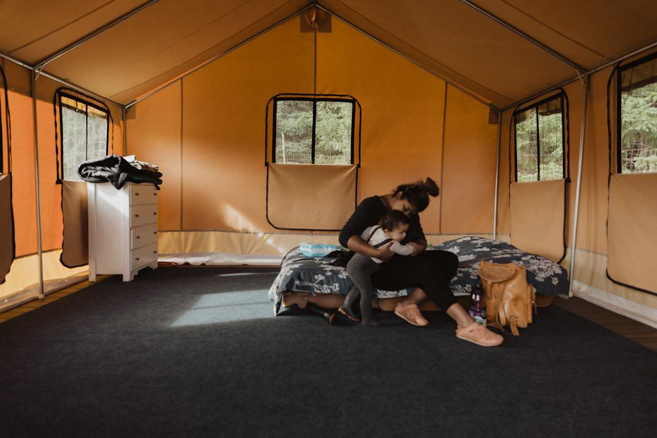 Minimalist amenities in the tent, a queen futon, a dresser, an extra sleeping bag and extra blanket. They plan to install a wood stove in the tent, this would be perfect for winter nights!