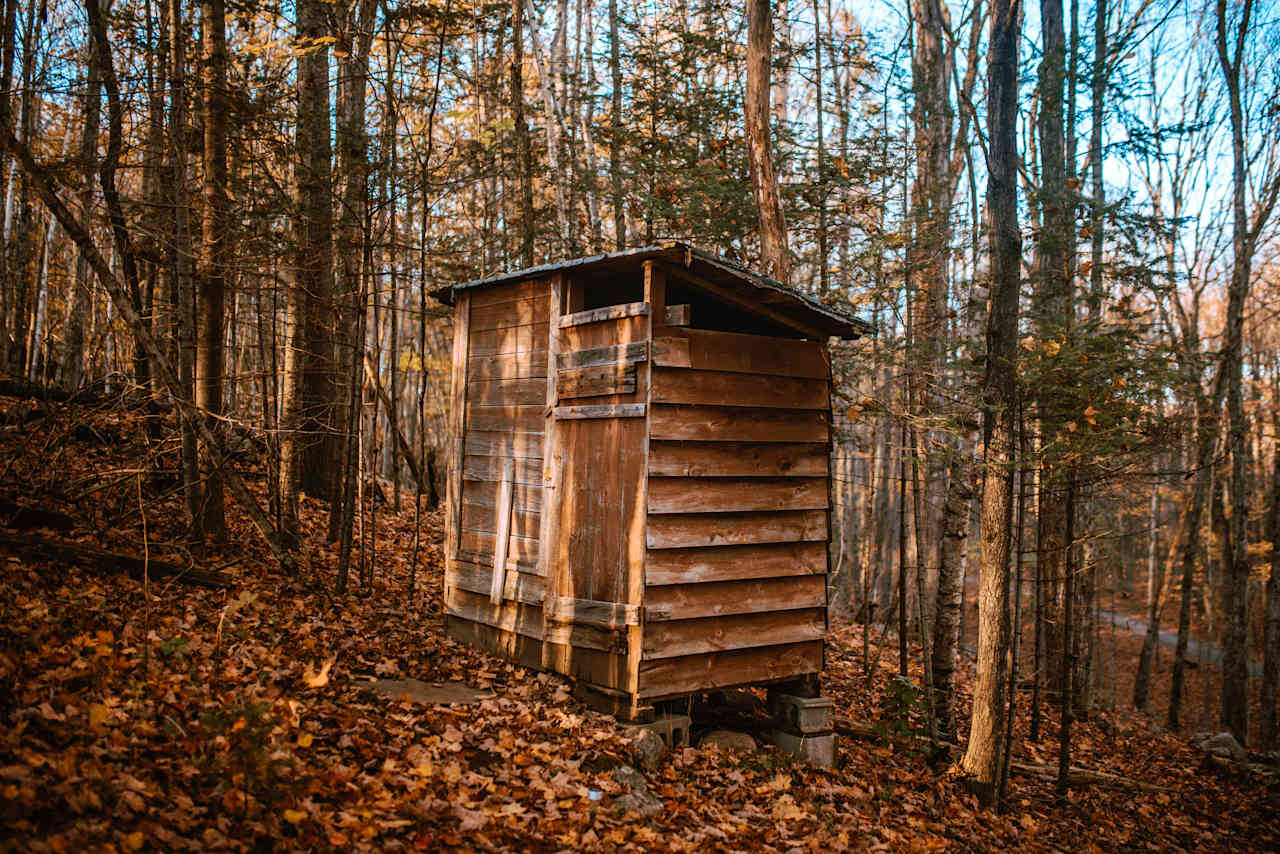 Clean outhouse at a convenient location just outside the cabin