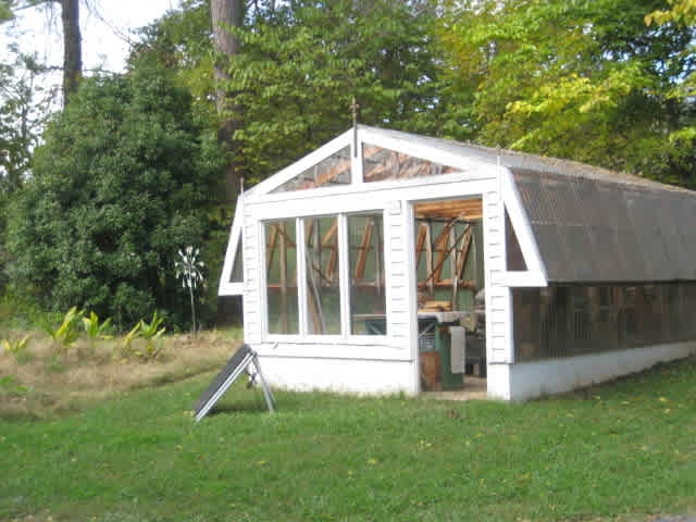 Greenhouse that is in process of being repurposed. Camp tent site is behind the greenhouse.