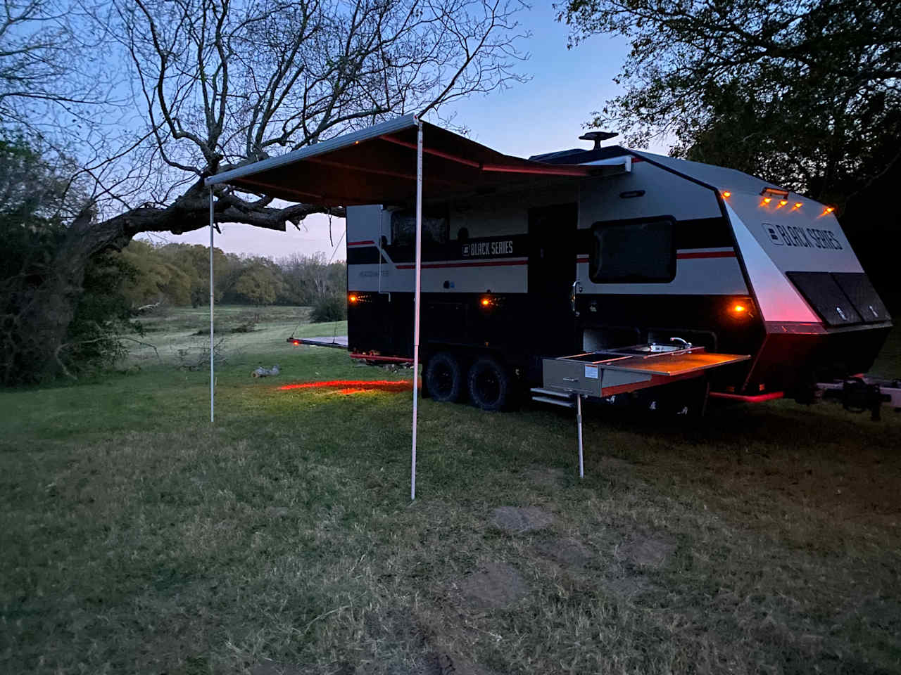 Awning, indoor outdoor shower, indoor outdoor stereo, indoor outdoor kitchen.