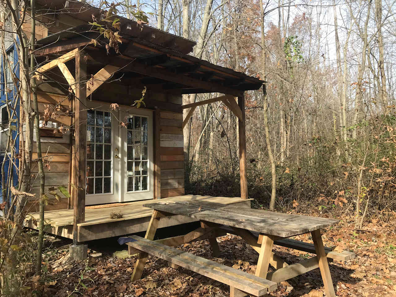 The Sunrise Cabin is the perfect getaway on our organic farm, complete with queen bed, porch, picnic table, and fire pit.