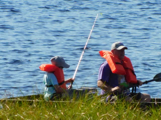 Father and son fishing on the lake