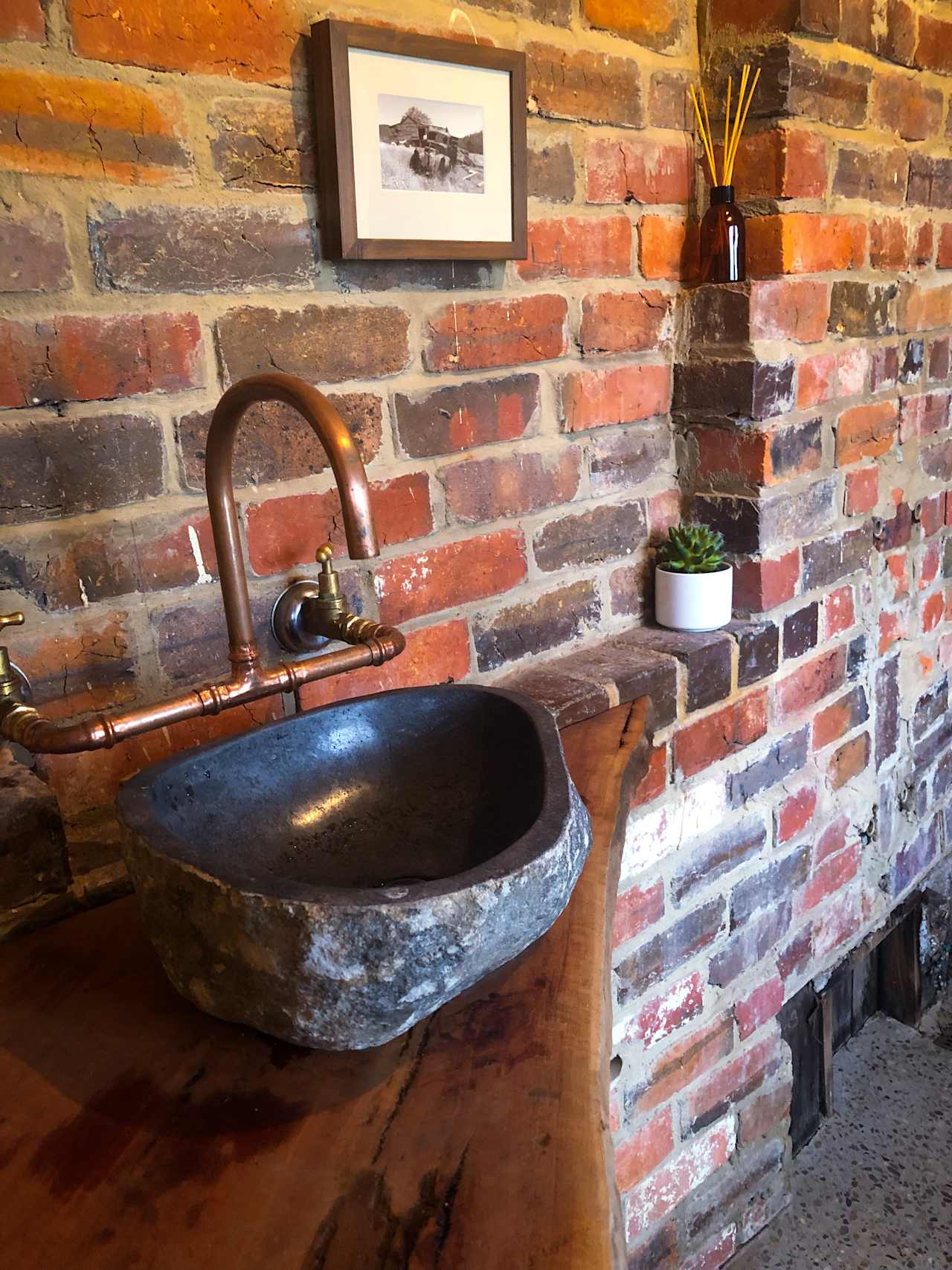 Rustic Brick and concrete bathroom 