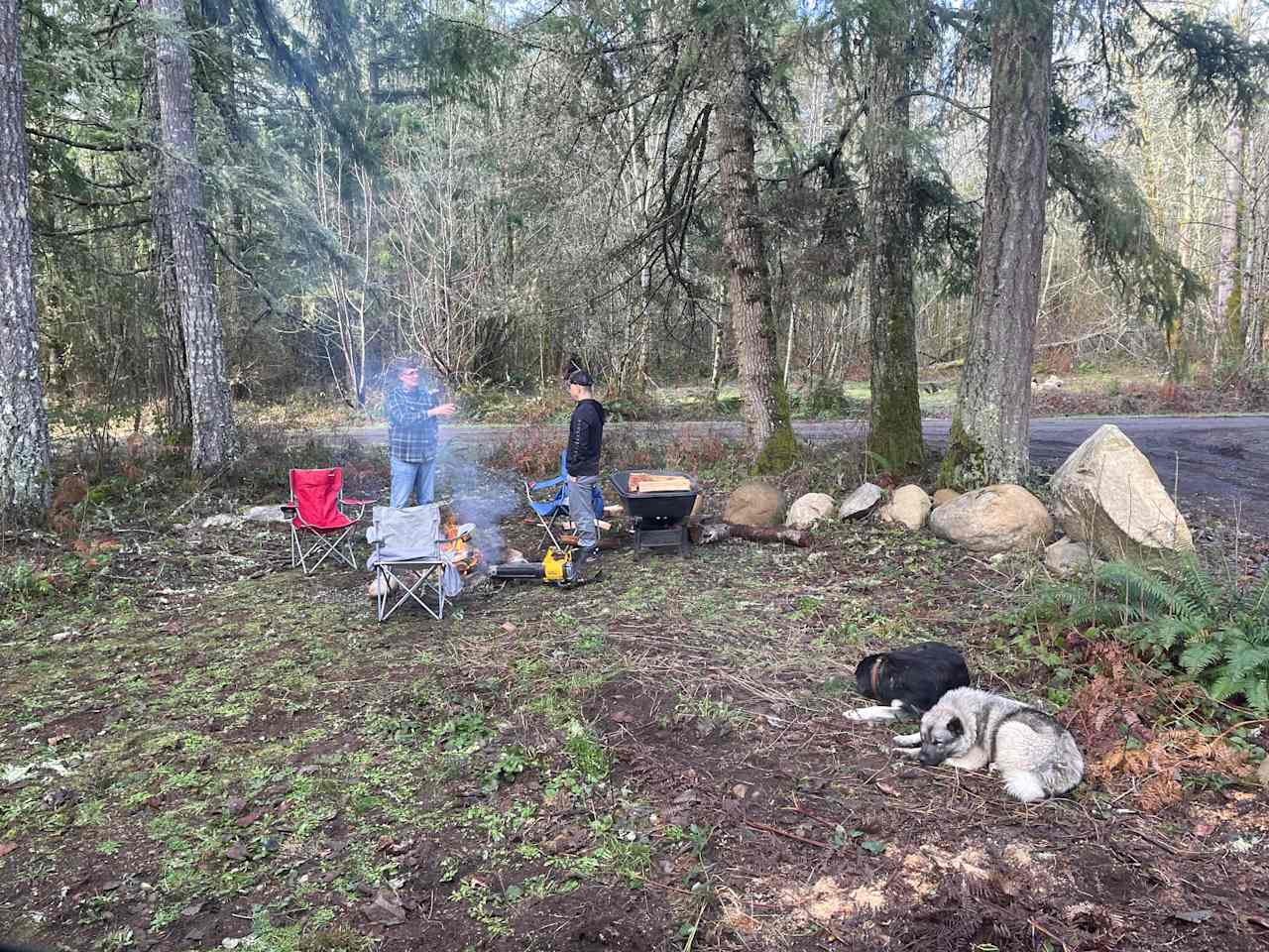 Dean (left) with my husband standing around the fire conversation. Zoey and Jake hanging out waiting for their dad to finish talking.