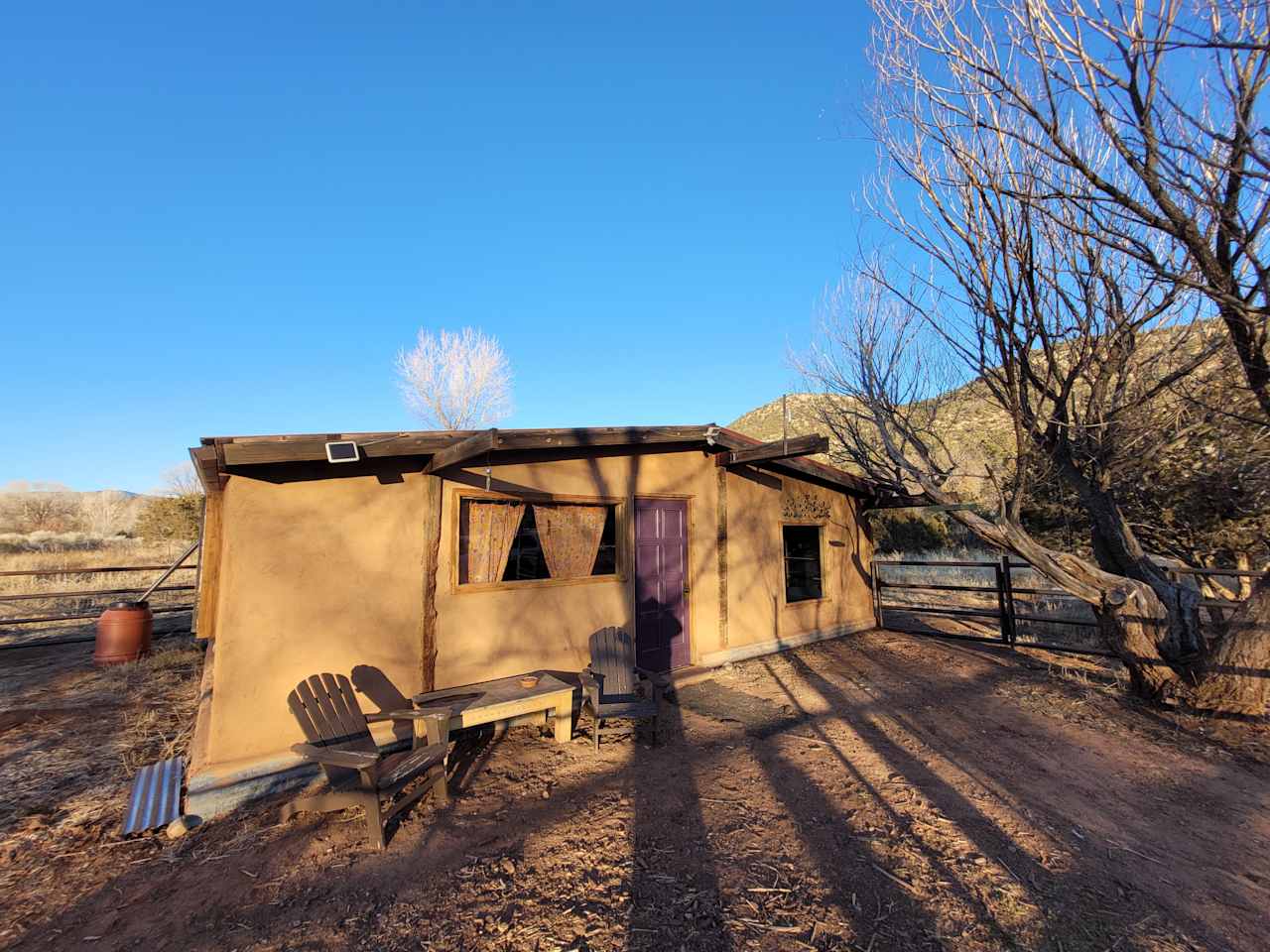 This used to be a simple pole barn used as a horse stable. We converted it using repurposed and reclaimed materials as well as straw and clay mud from the land. 