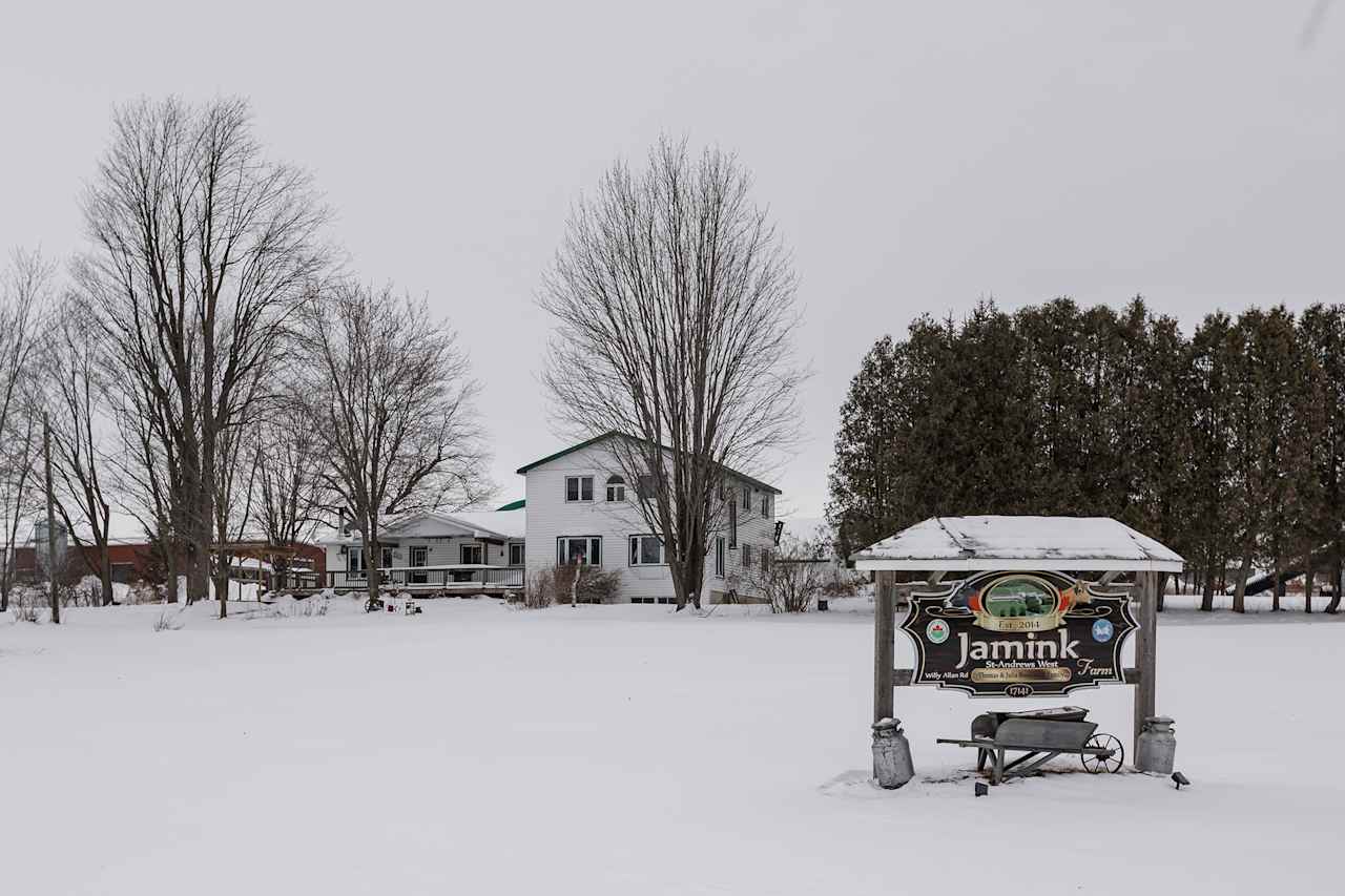 Campers are greeted with a sign that can be seen from the road advertising the family farm. 