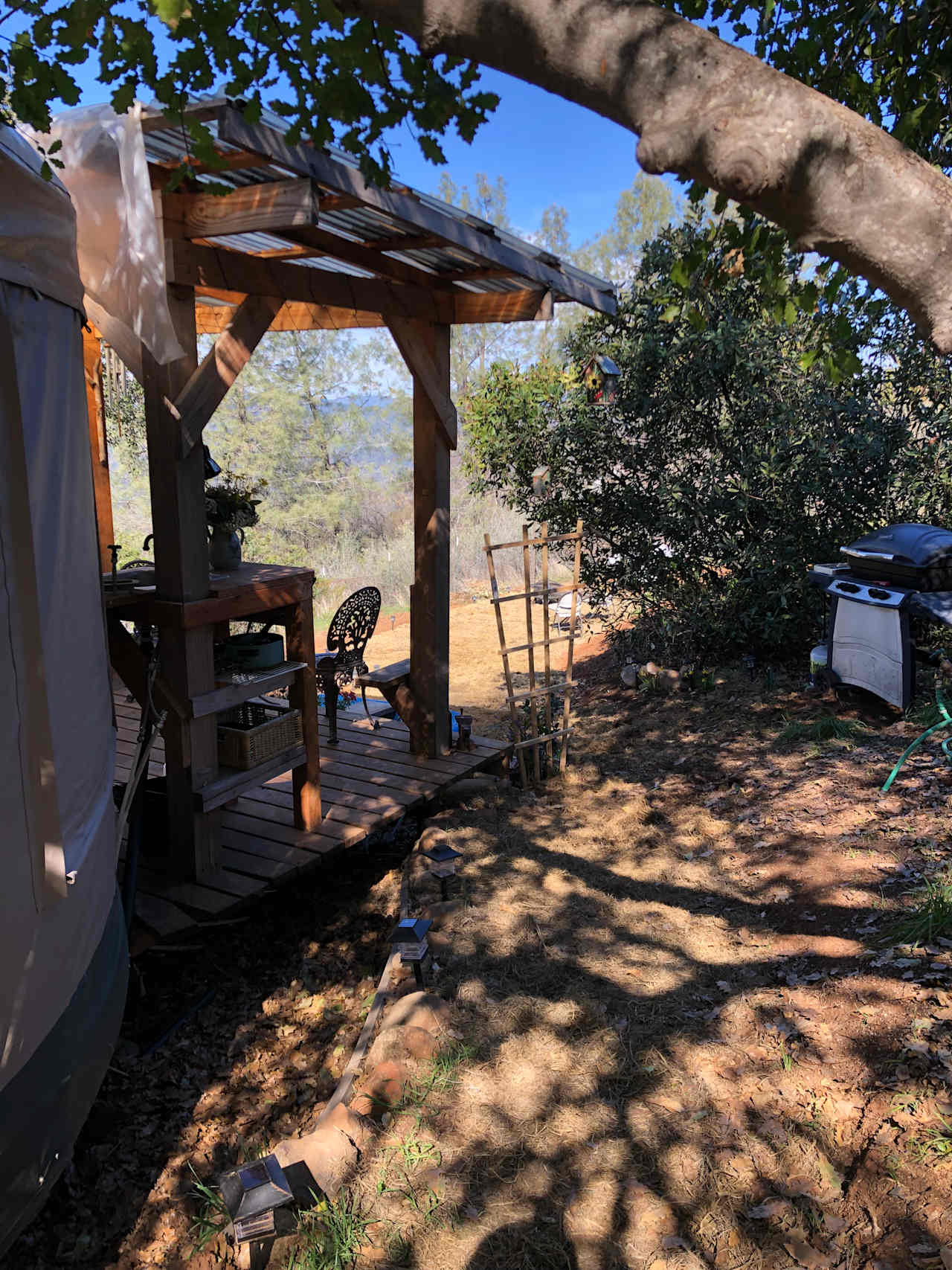 View from the side of the yurt with the grill to the right