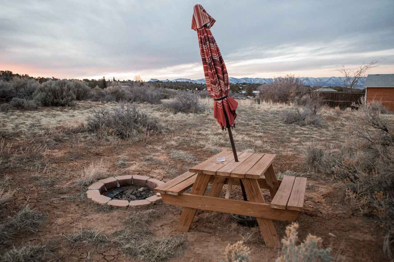 The cabin also has a picnic area and firepit just outside of it as well. 