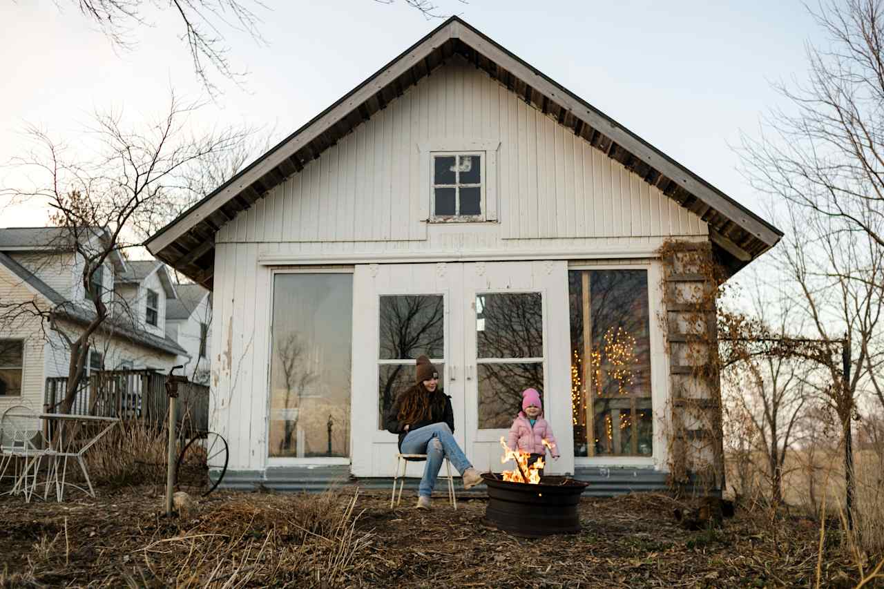 Hanging out by the fire pit in front of the garden shed.