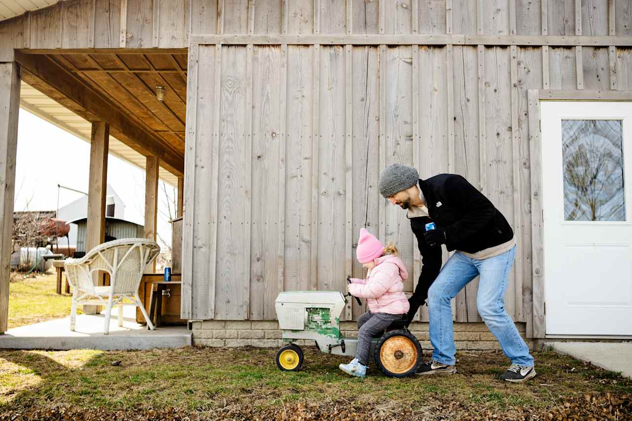 dad and babe playing with the tractor. 