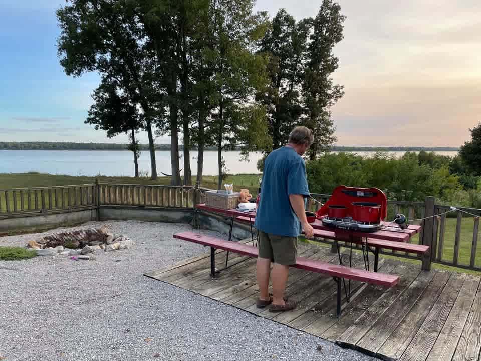 Site 20 is a large site that can accommodate up to 45ft RV. This site features a spacious fire pit area, and screened in porch with a great view. 