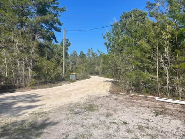 Site 1 road on right and site 2 on left trash bin located on the left.