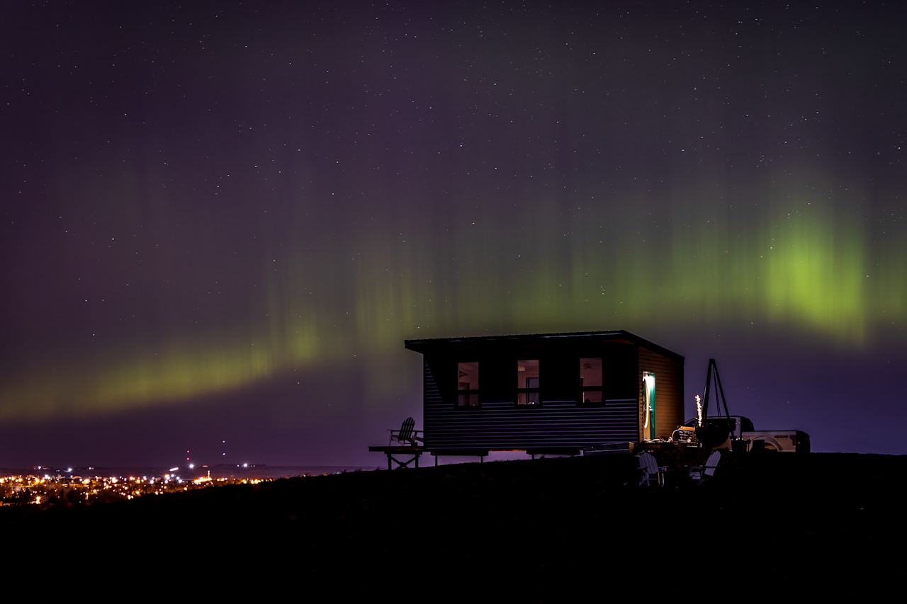 Catch a glimpse of the dancing lights out in the wide open prairie skies