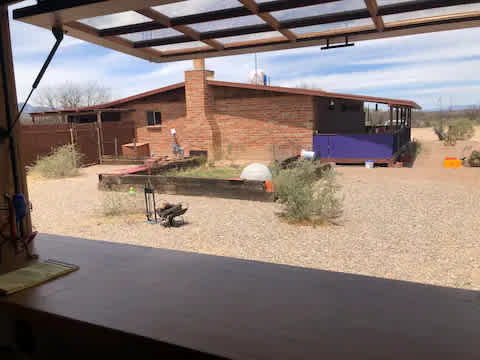 View of the main house with the French window up.