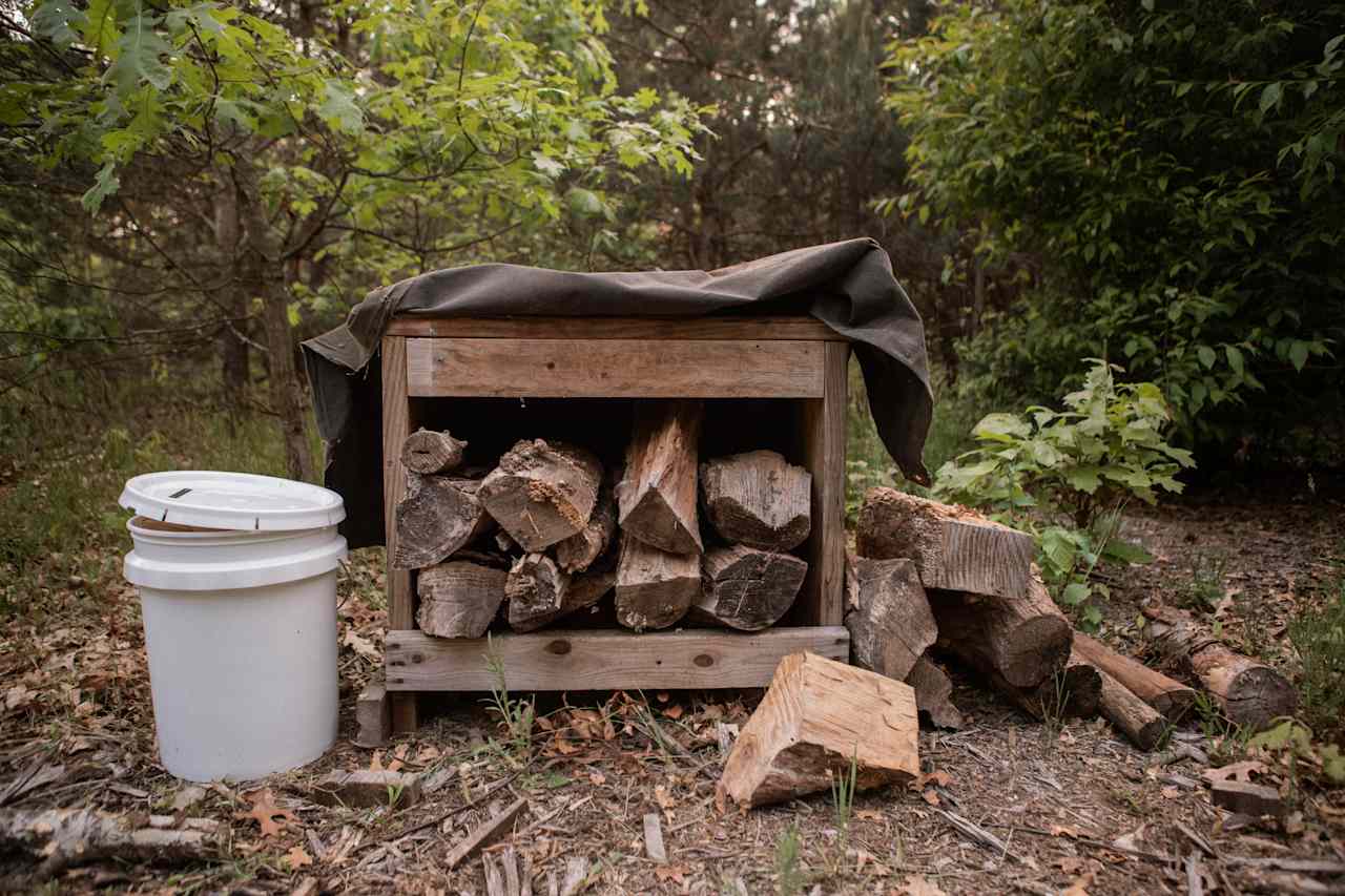 The firewood is kept safe and dry in this covered structure!