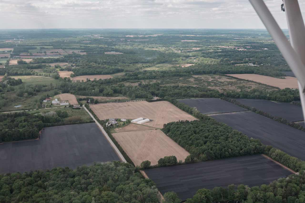 Aerial photograph of the property. The site sits on 49 acres of land with the camping spots in the forested area. 