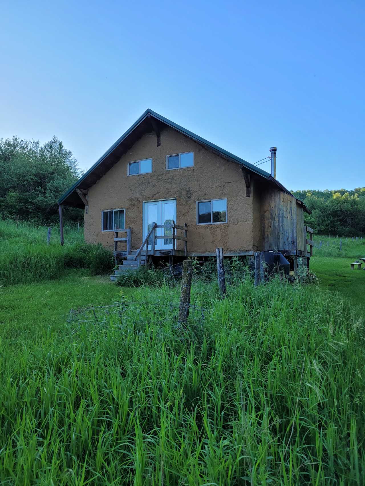 Our earthen cabin nestled in the valley. 